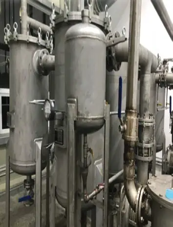 Hệ thống bồn lọc inox và đường ống tại dây chuyền kéo sợi